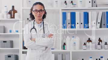 My career is certainly very interesting. Portrait of a young doctor standing in a lab.