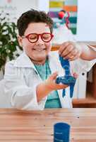 I think Ive gotten myself into a sticky situation here. an adorable young school boy playing and experimenting with slime in science class at school.