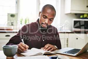 Your work ethic speaks volumes about you in business. a handsome man going over paperwork and using his laptop while working from home during the day.