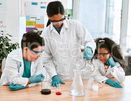 Watch what happens when we do this... an adorable little boy and girl conducting a scientific experiment with their teacher at school.