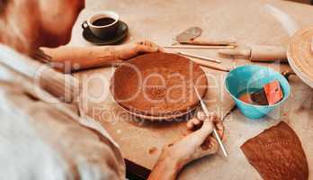 Every piece I make is my favorite. an unrecognizable artisan working in a pottery workshop.