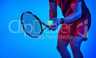 Find something youre good at and stick to it. Blue filtered shot of an unrecognizable tennis player getting ready to serve.