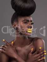 The best makeup tool is your creativity. Studio shot of a beautiful young woman posing against a grey background.