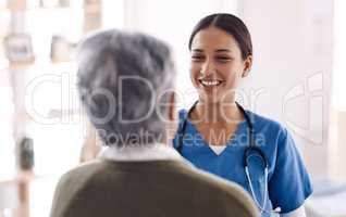 Ill do all I can to ensure your health and wellbeing. a young doctor talking to a senior woman.