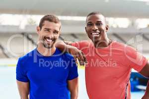 We push each other to be faster. Cropped portrait of two handsome young male athletes standing outside at the track.