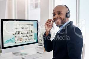 Call me if you need help on our site. a call centre agent sitting at his desk.