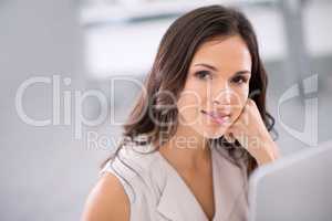 Smiling woman with a computer thinking, brainstorming and planning creative property marketing advertisement or social media post on new house. Portrait of confident real estate agent in office alone