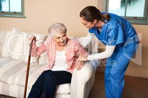 A caregiver will change your life for the better. a caregiver assisting her senior patient at home.