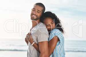 The best thing to hold onto in life is each other. a young couple enjoying some quality time together at the beach.