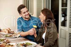 I want to treat you like you treat me. a couple enjoying a meal together in the yard at home.