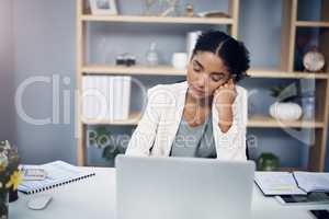 Tired, burnout and overworked woman working on a laptop in an office, sleepy and taking a nap. Young female suffering from fatigue and low energy, unfocused and struggling to manage an online task