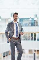 Confidence will establish your career. Portrait of a confident young businessman standing in an office.