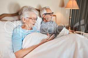 Did you see the news this morning. a senior couple sitting in bed together and using technology in a nursing home.