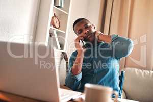 Headache, stress and pain while talking on a phone call and working from a laptop at home. Worried, anxious man rushing to meet a deadline, looking unhappy while suffering from neck pain and tension