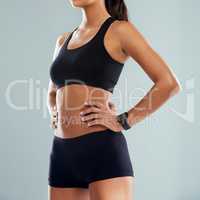 Only you can make the best decision for your health. Studio shot of an unrecognizable sporty woman posing with her hands on her hips against a grey background.