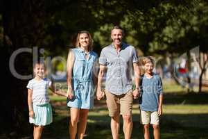 Nobody is perfect but were perfect together. a happy young family going for a walk in the park.