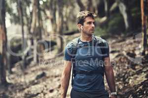 Nothing else matters when hes hiking. a handsome young man out for a hike in the mountains.