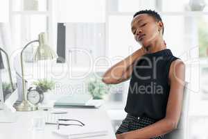 Take care of yourself before stress takes care of you. a young businesswoman experiencing stress at work.