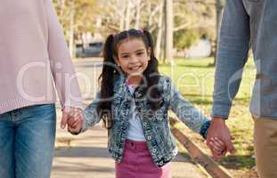 Lets go to the park. an adorable little girl going for a walk in the park with her parents.