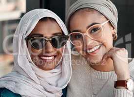 Soulmates exist in friendships too. Cropped portrait of two affectionate young girlfriends hanging out together in a cafe while dressed in hijab.