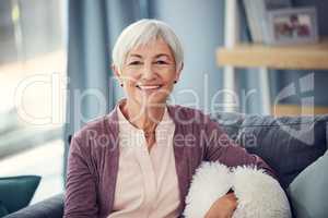 Seventy is the new fifty. Cropped portrait of a happy senior woman relaxing comfortably on her couch at home.