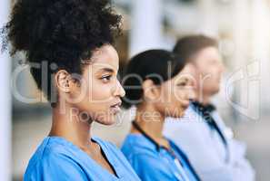 Theres no doubt that theyre dedicated to their job. Defocused shot of a group of medical practitioners standing together.