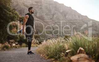 Hold onto that strong sense of determination. a sporty young man exercising outdoors.