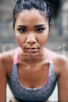 Winners always keep going. Portrait of an attractive young sportswoman exercising outdoors.