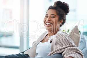 Id make every day my off day just to relax. Cropped portrait of a happy young woman relaxing on her couch at home.