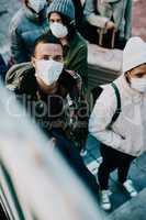 People traveling during covid travel restrictions are waiting for coronavirus testing. Portrait of tourists or travelers walking on stairs in a public airport during a lockdown due to virus outbreak