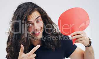Read the following statement. Portrait of a handsome young man holding a speech bubble against a grey background.