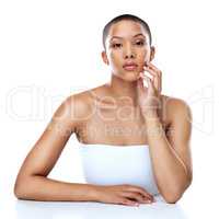 She has something to tell you. Portrait of a beautiful young woman striking a pose against a white background.