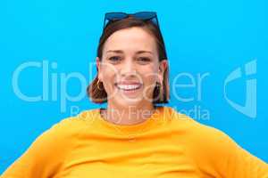 Cheer up and put on your best smile. Cropped portrait of a happy young woman smiling against a blue background.