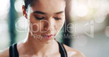 It all pays off in the end. Closeup shot of an attractive young sportswoman taking a break from working out in a gym.