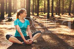 The beauty is just so inspiring. a sporty young woman spending the day out in nature.