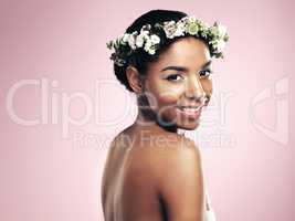 Your power is that no one is you. Studio shot of a beautiful young woman wearing a floral head wreath.