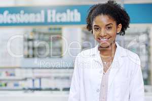 With us your wellbeing is the first priority. Portrait of an attractive young pharmacist smiling and posing in a pharmacy.