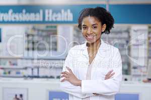 Its time you also changed your perception of health care. Portrait of an attractive young pharmacist smiling and posing with her arms folded in a pharmacy.