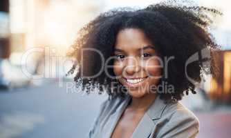 Get out there and discover what new opportunities there are. Portrait of a young businesswoman in the city.