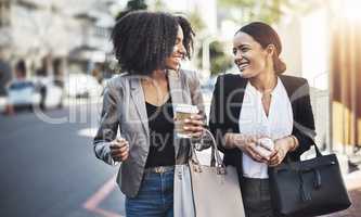 Heading in to the office with absolute optimism. two businesswomen walking in the city.