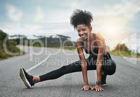 Stretching should be the start of every workout. Full length portrait of an attractive young sportswoman warming up for a workout outdoors.