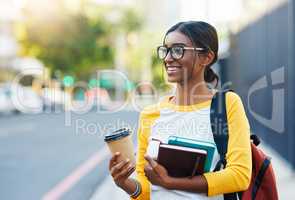 Commuting in the city to college. a young female student commuting to college in the city.