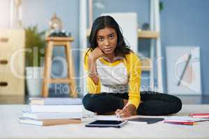 This is how I prep for finals. a young female student studying at home.