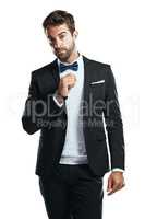Ill be your date for the evening. Studio shot of a handsome young man wearing a tuxedo against a white background.