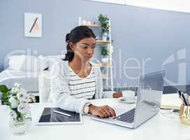 Its time for my daily post. an attractive young woman working at home.