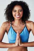 Meditate and be the happier version of yourself. Studio shot of an athletic young woman practicing yoga against a grey background.