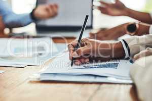 Business analyst hands writing on paperwork, making notes and checking data, charts and graphs in an office boardroom meeting. Closeup of man monitoring company growth, profit and analyzing documents