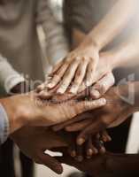 Hands, teamwork and support with a group or team of people showing togetherness, unity and solidarity in a gesture of working together, trust and collaboration. Closeup of cooperation and motivation