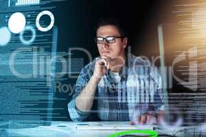 Male IT computer engineer working on a futuristic hologram or cgi screen at his office desk. Tech designer working on technology to test new and innovative data. Web developer work on a digital code