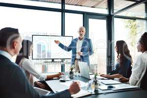 Education, training or learning on screen in business boardroom meeting to analyze data, chart or report. Manager with team of motivated executives in workshop presentation to plan vision or strategy